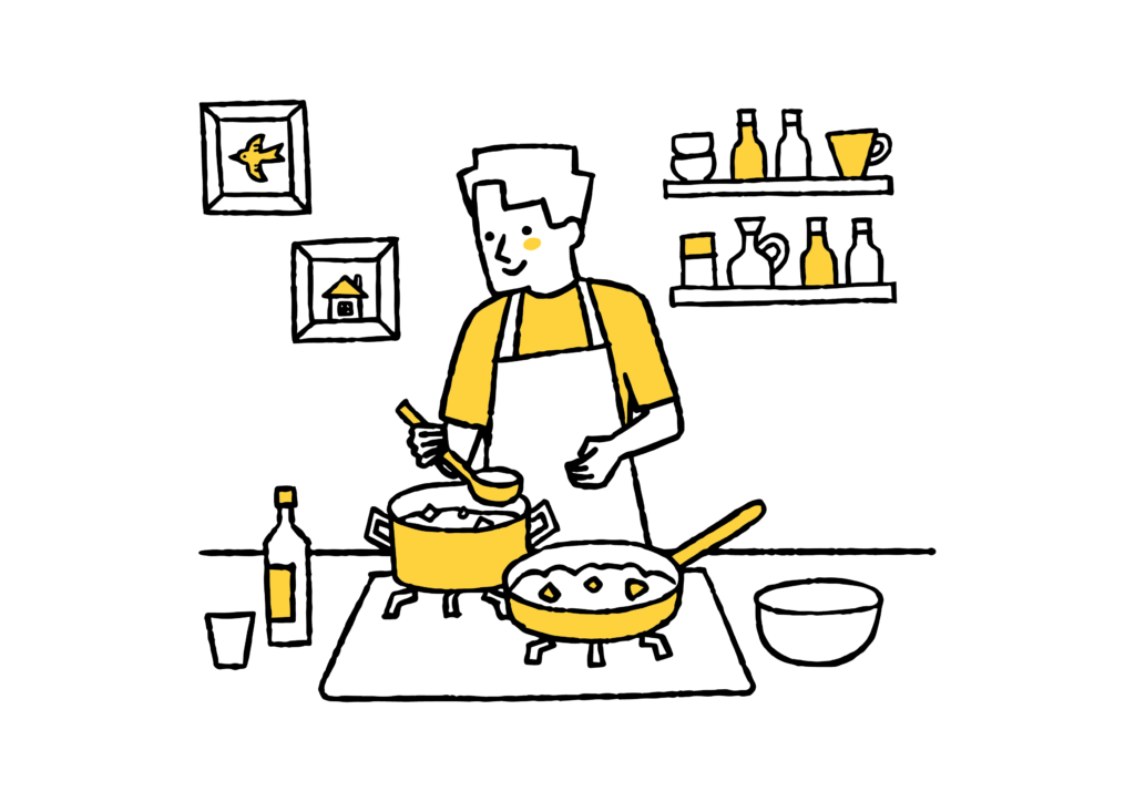 キッチンで料理をしている男性